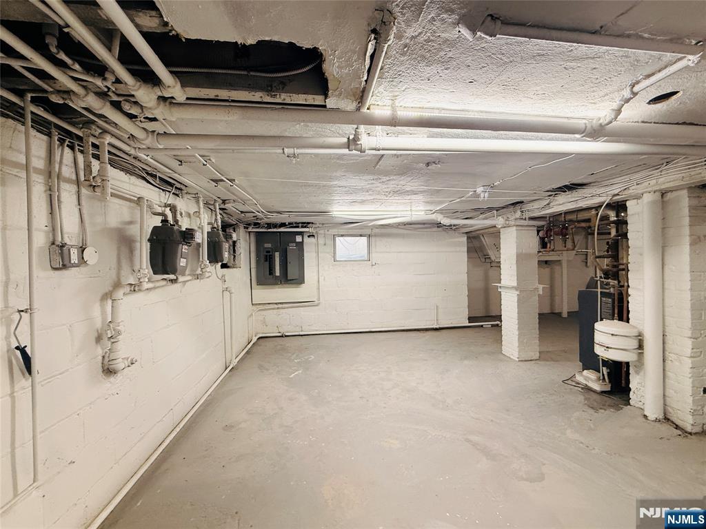 86 West Main Street, Unit FIRST Bergenfield, NJ 07621 - Photo 23 of 23 a view of a big room with wooden floor and windows