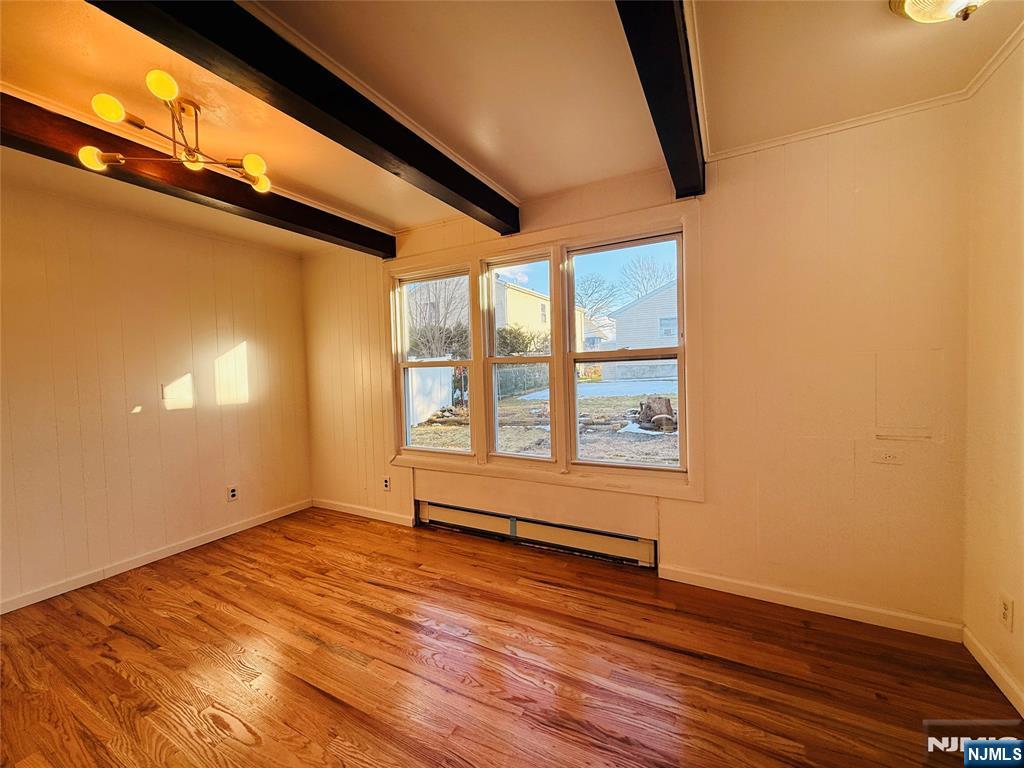 86 West Main Street, Unit FIRST Bergenfield, NJ 07621 - Photo 6 of 23 a view of empty room with wooden floor and fan