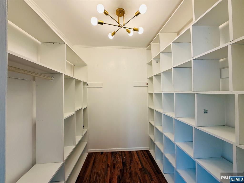 86 West Main Street, Unit FIRST Bergenfield, NJ 07621 - Photo 7 of 23 a view of walk in closet with empty racks