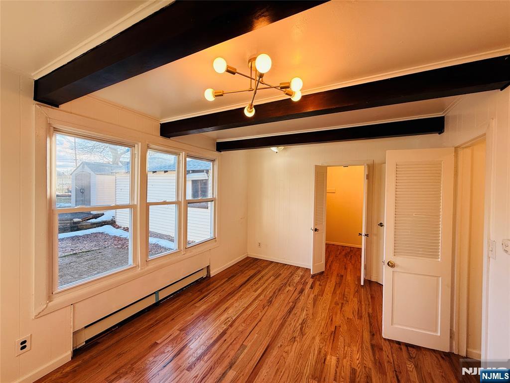 86 West Main Street, Unit FIRST Bergenfield, NJ 07621 - Photo 9 of 23 a view of front door and wooden floor