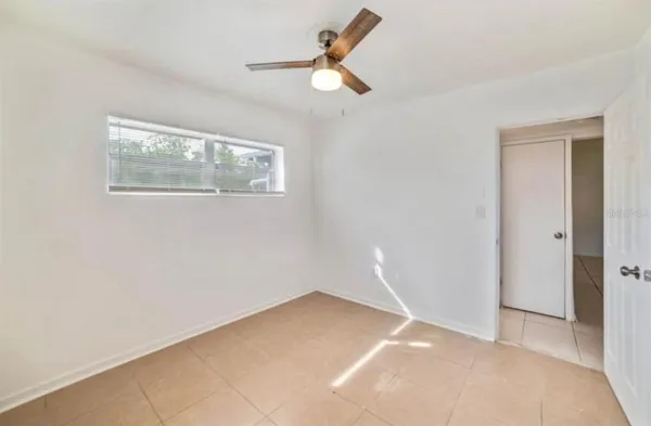 a view of an empty room with a window