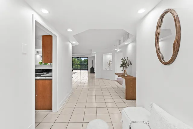 a view of a hallway with washer and dryer