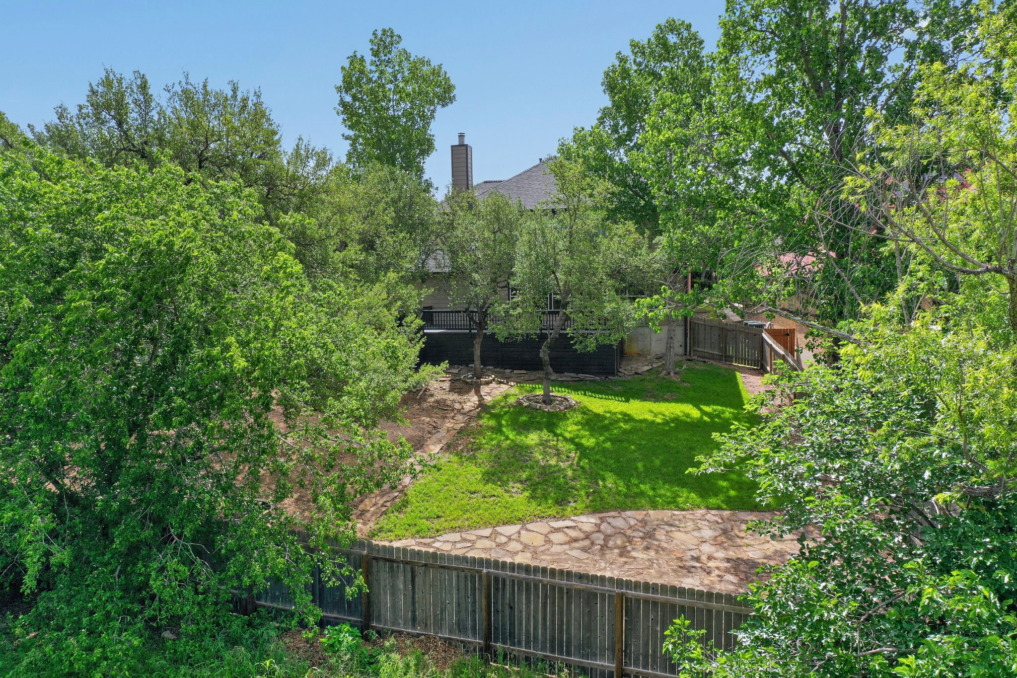 8617 Cobblestone Austin, TX 78735 - Photo 37 of 39 a backyard of a house with lots of green space