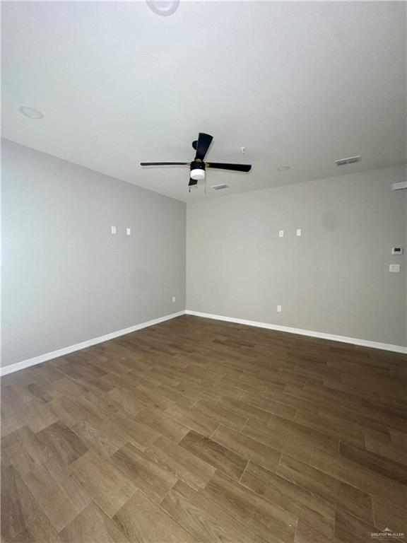 720 Ragland Road, Unit 8 Mission, TX 78572 - Photo 16 of 17 wooden floor in an empty room