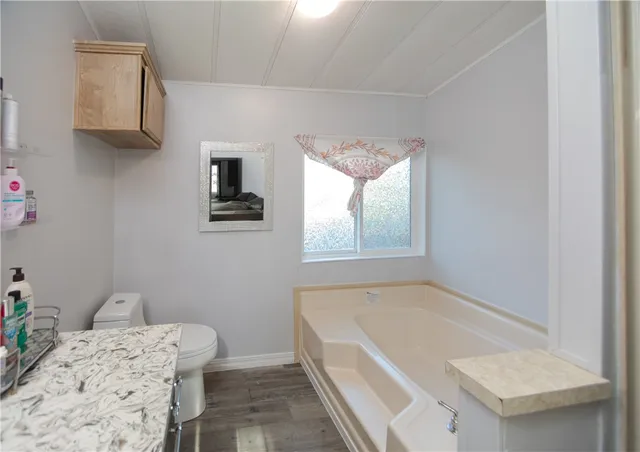 a bathroom with a tub and shower