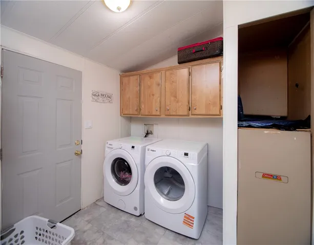 a bathroom with a sink a toilet and shower curtain