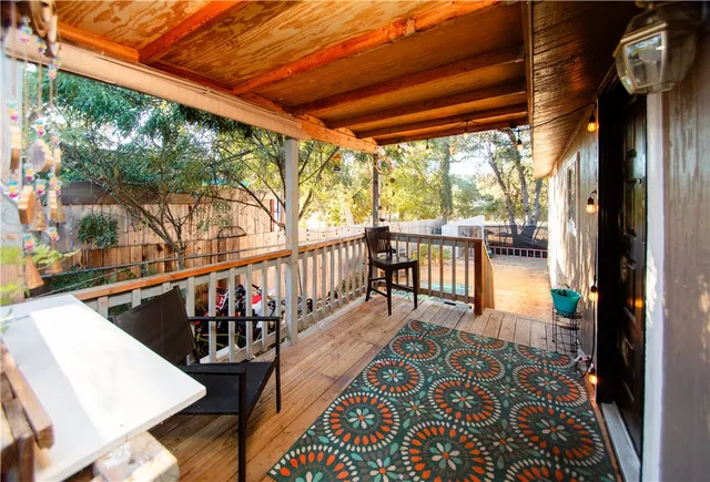 a view of a patio with dining table and chairs