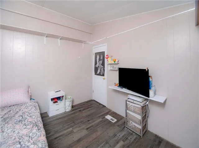 a bed room with a bed and a window