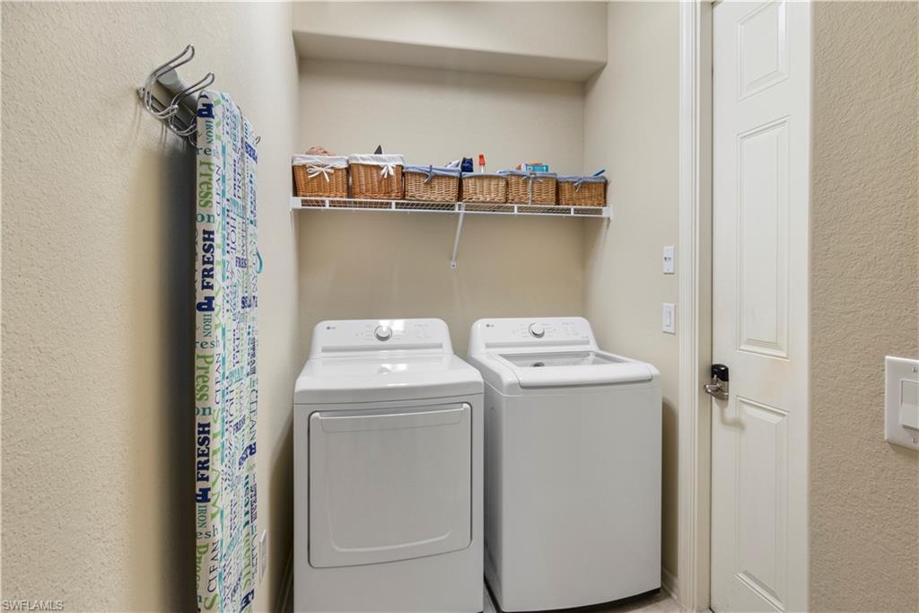 9063 Capistrano Street North, Unit 4405 Naples, FL 34113 - Photo 13 of 40 a utility room with dryer and washer