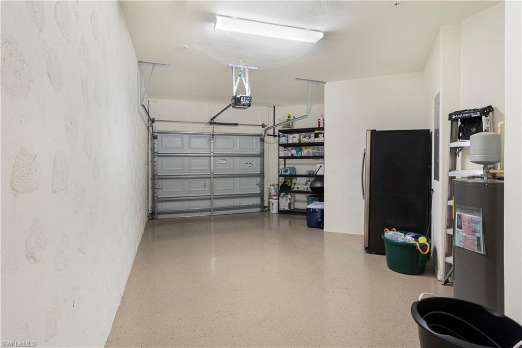 9063 Capistrano Street North, Unit 4405 Naples, FL 34113 - Photo 14 of 40 a view of walk in closet with clothes and shoes