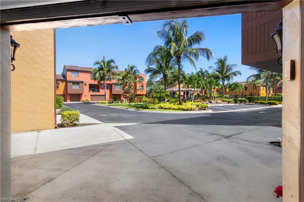 9063 Capistrano Street North, Unit 4405 Naples, FL 34113 - Photo 15 of 40 a view of building along with street