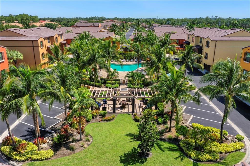 9063 Capistrano Street North, Unit 4405 Naples, FL 34113 - Photo 17 of 40 a view of a garden with plants