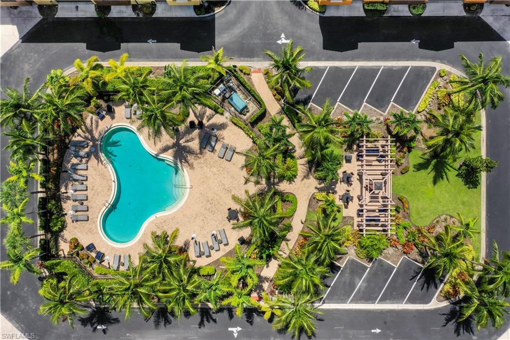 9063 Capistrano Street North, Unit 4405 Naples, FL 34113 - Photo 21 of 40 an aerial view of a house with a yard and a garden