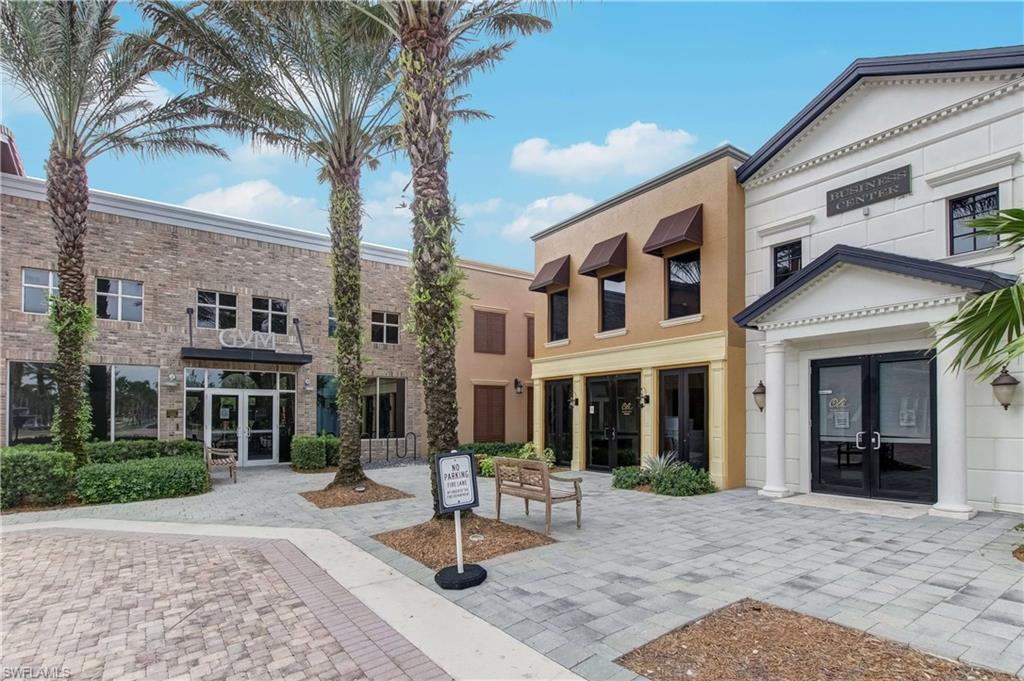 9063 Capistrano Street North, Unit 4405 Naples, FL 34113 - Photo 37 of 40 a front view of a building with street view