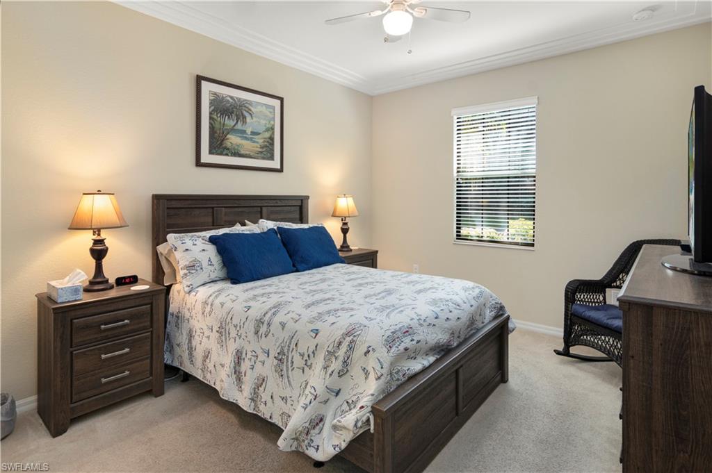 9063 Capistrano Street North, Unit 4405 Naples, FL 34113 - Photo 7 of 40 a bedroom with bed and a window