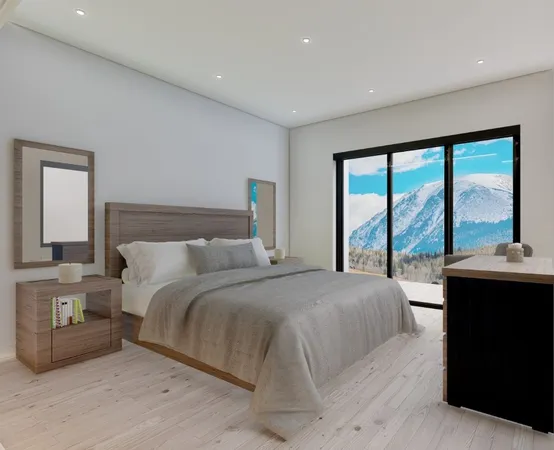 a bedroom with a large bed and a large window