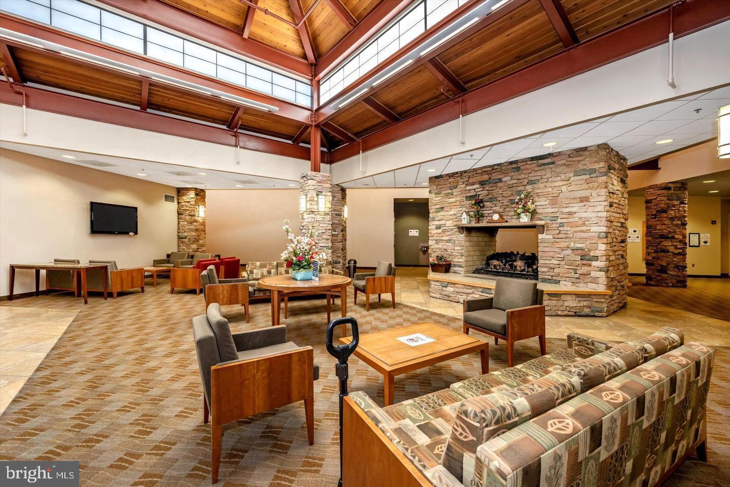 3330 North Leisure World Boulevard, Unit 5109 Silver Spring, MD 20906 - Photo 37 of 44 Fireside lounge