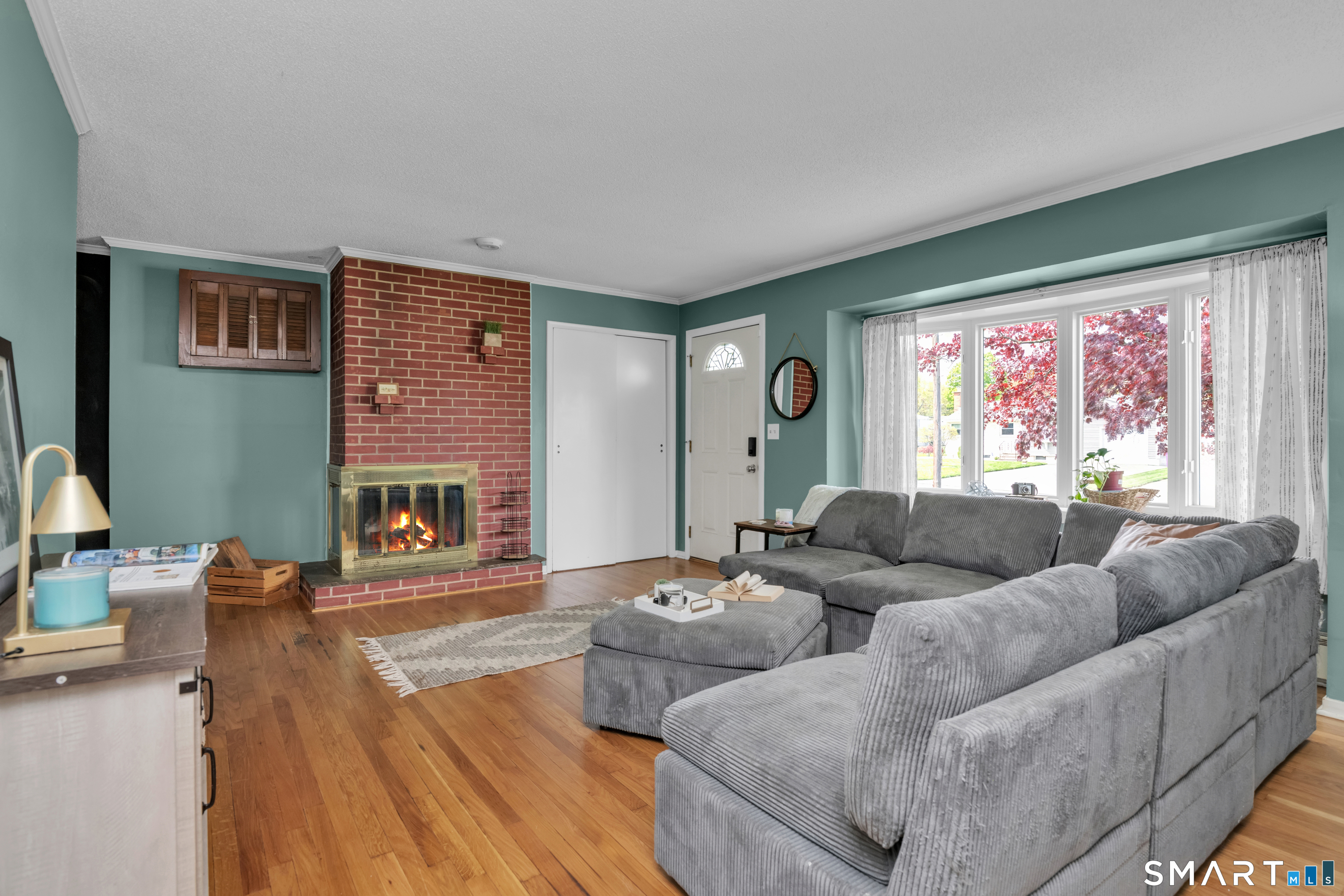 81 Crystal Street Wethersfield, CT 06109 - Photo 14 of 40 a living room with furniture and a fireplace
