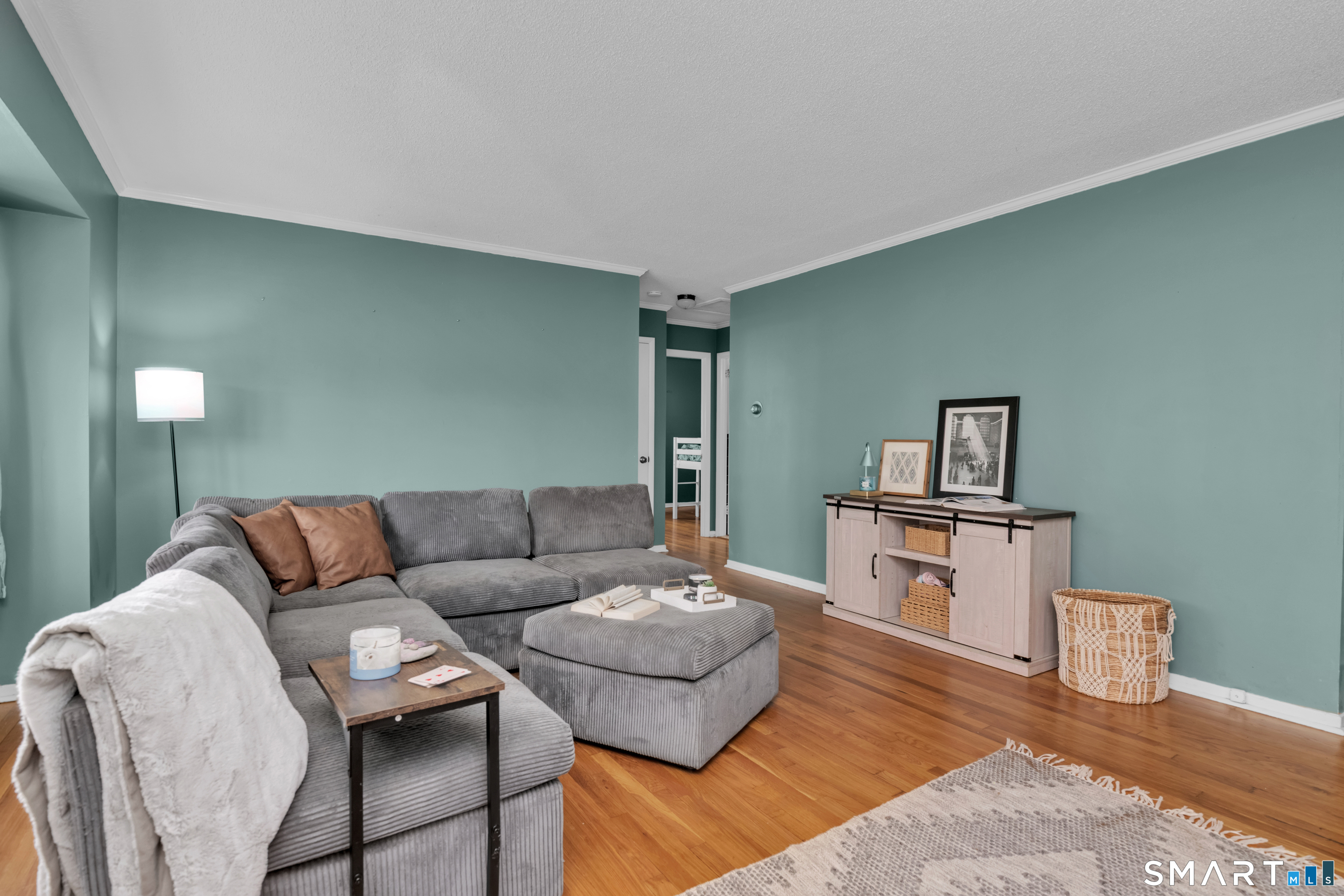 81 Crystal Street Wethersfield, CT 06109 - Photo 35 of 40 a living room with furniture and a wooden floor