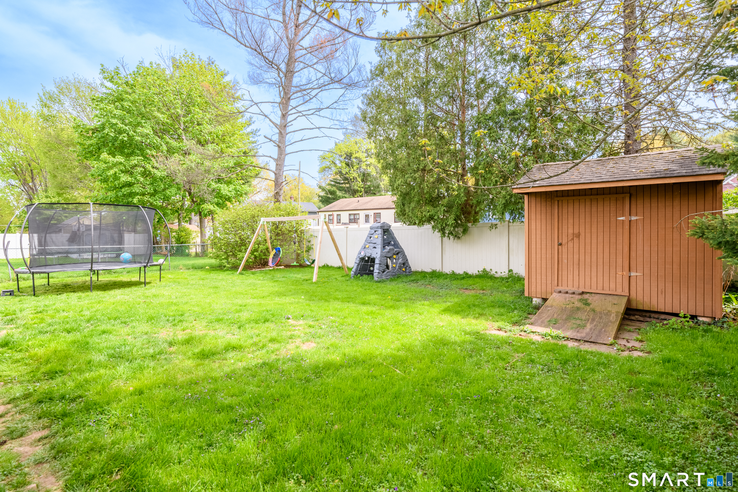 81 Crystal Street Wethersfield, CT 06109 - Photo 8 of 40 a view of a backyard with a garden