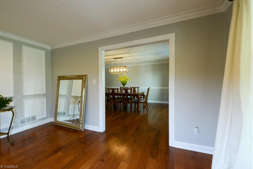 1410 Heathcliff Road High Point, NC 27262 - Photo 12 of 50 Living room flows into dining room with large door openings
