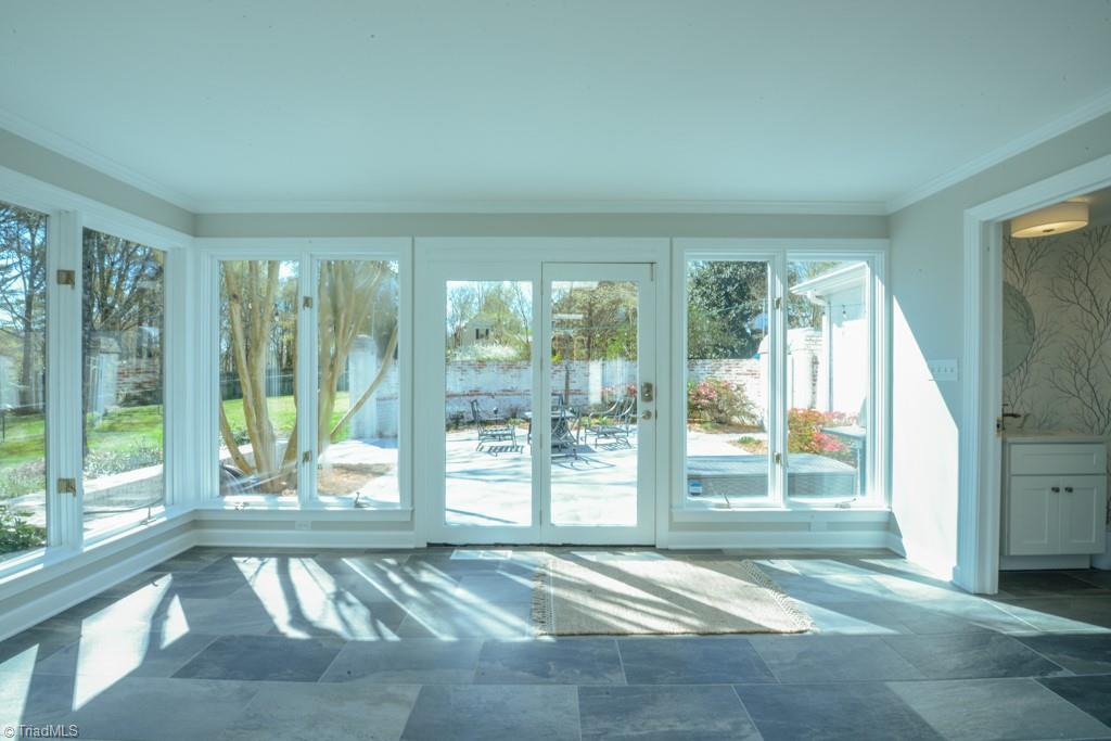 1410 Heathcliff Road High Point, NC 27262 - Photo 27 of 50 So much natural light and the sunroom opens onto the patio