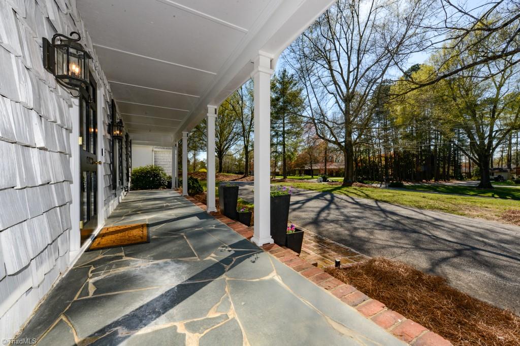 Love this slate rocking chair front porch and circle drive