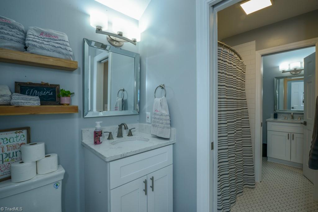 1410 Heathcliff Road High Point, NC 27262 - Photo 47 of 50 the upstairs bedrooms share a Jack and Jill bath that has been renovated