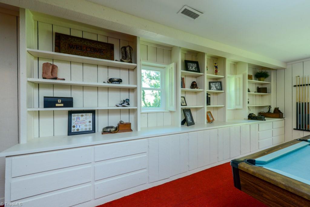 1410 Heathcliff Road High Point, NC 27262 - Photo 50 of 50 Display all of your collectibles in this rec room in the walkout basement