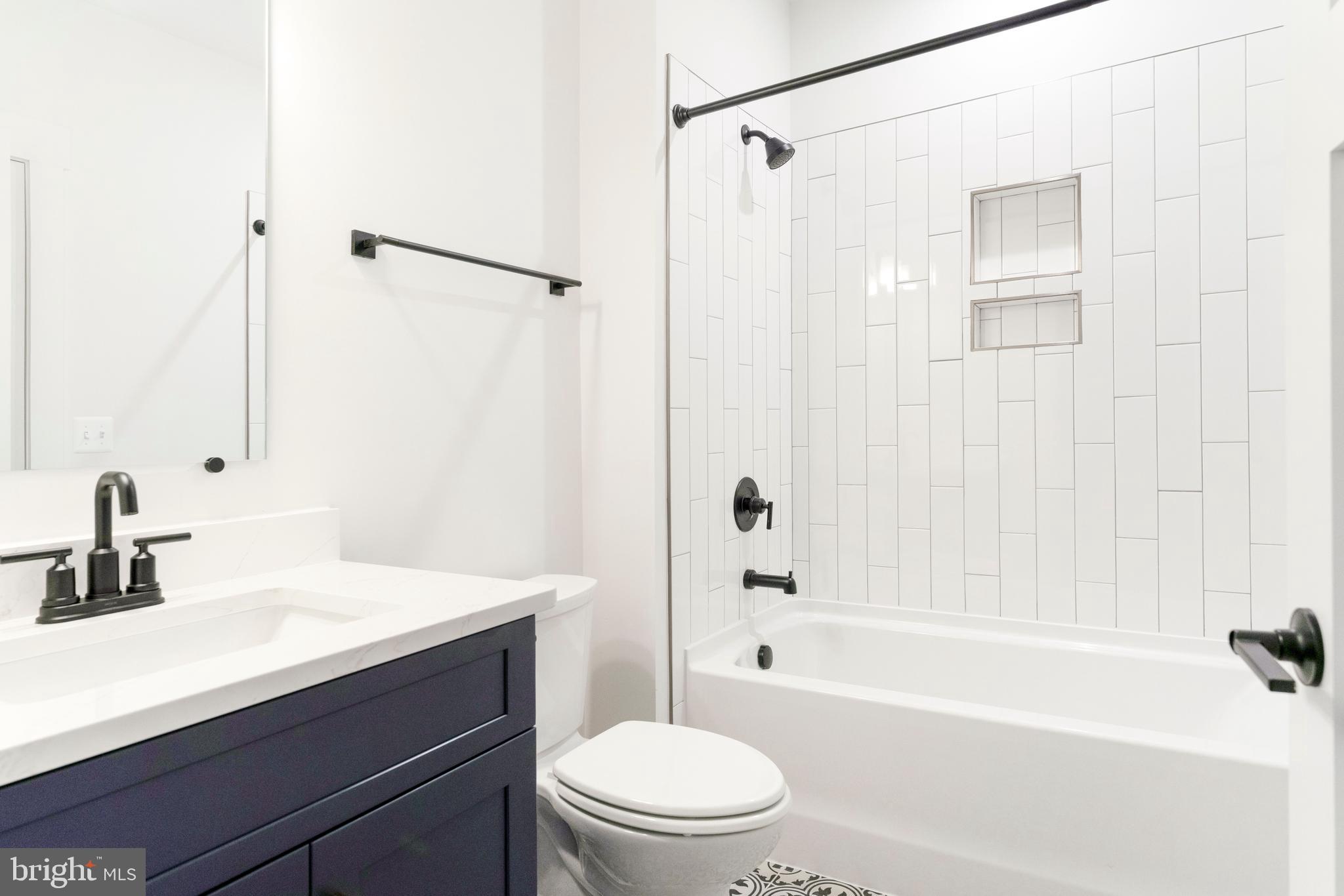 3321 Patuxent River Road Davidsonville, MD 21035 - Photo 63 of 81 a bathroom with a sink a toilet and shower