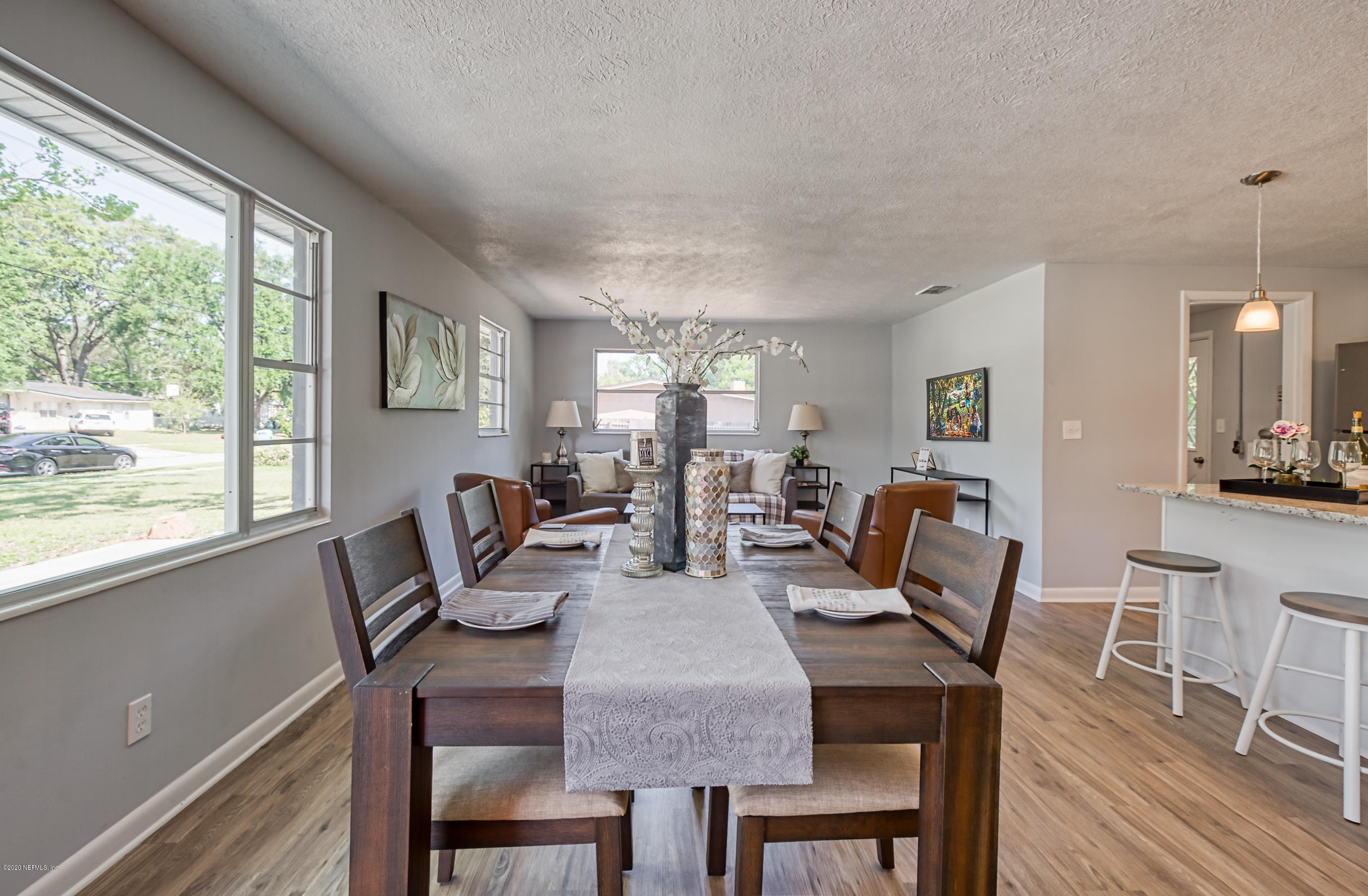 471 Sigsbee Road Orange Park, FL 32073 - Photo 1 of 17 a view of a dining room with furniture window and wooden floor
