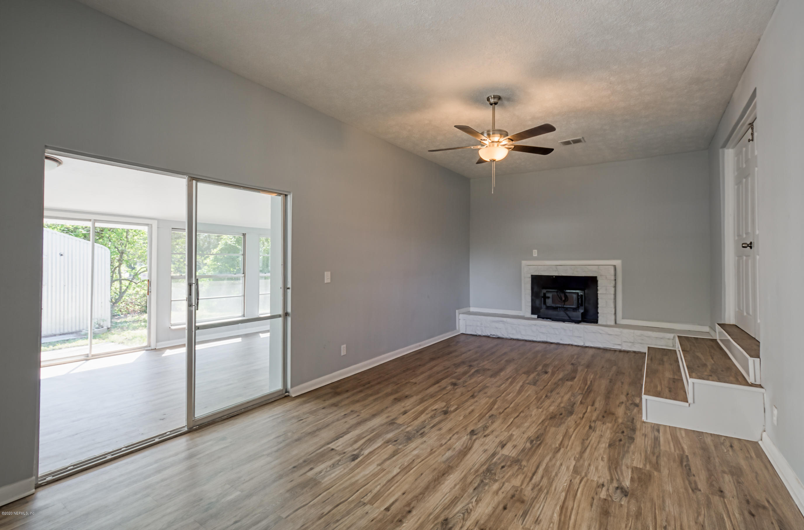 471 Sigsbee Road Orange Park, FL 32073 - Photo 13 of 17 an empty room with fan and windows