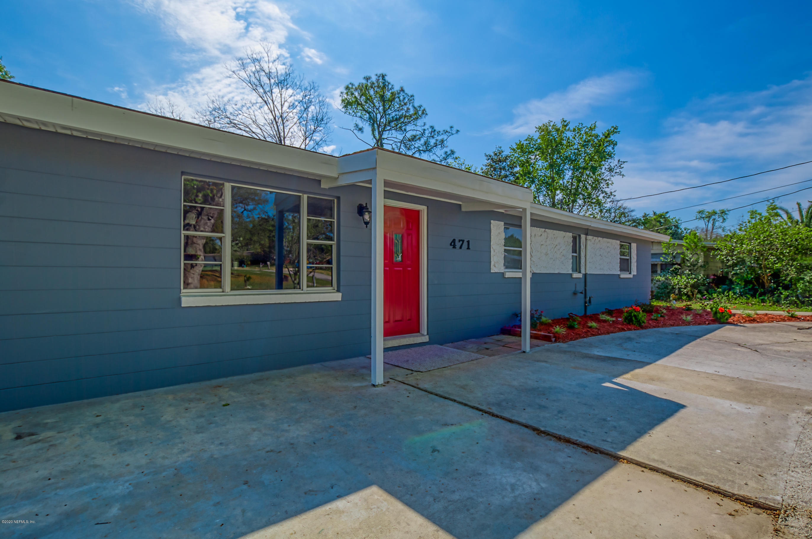 471 Sigsbee Road Orange Park, FL 32073 - Photo 17 of 17 a view of a house with a yard and garage