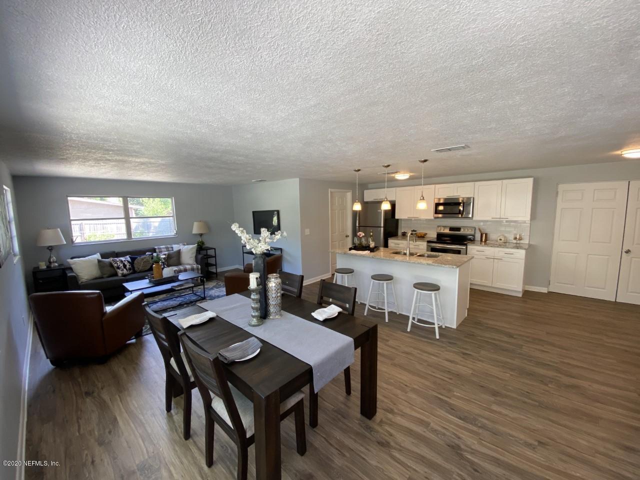 471 Sigsbee Road Orange Park, FL 32073 - Photo 5 of 17 a open dining room with furniture and wooden floor