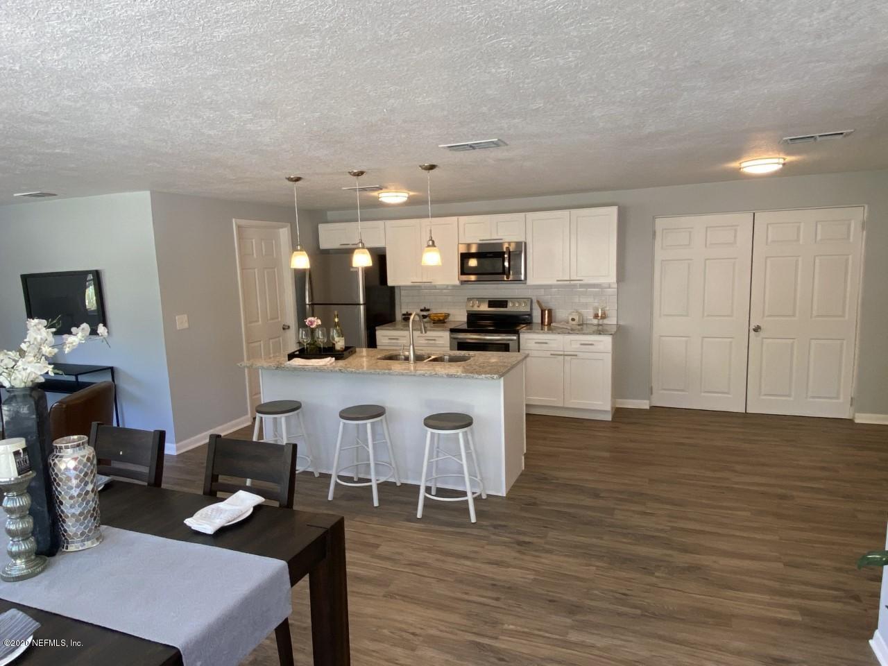 471 Sigsbee Road Orange Park, FL 32073 - Photo 7 of 17 a kitchen with cabinets a counter space and a sink