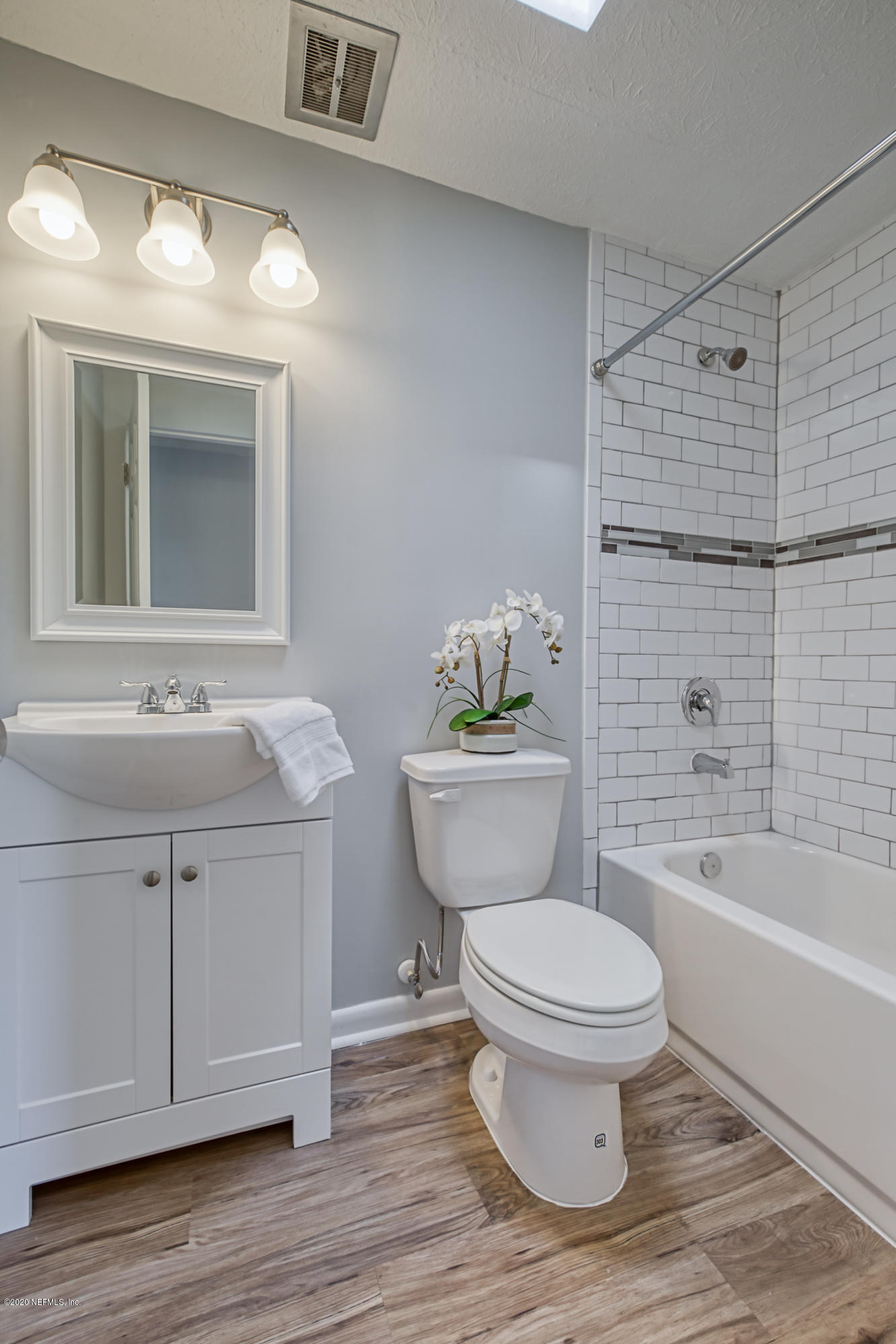 471 Sigsbee Road Orange Park, FL 32073 - Photo 9 of 17 a bathroom with a sink toilet a mirror and shower