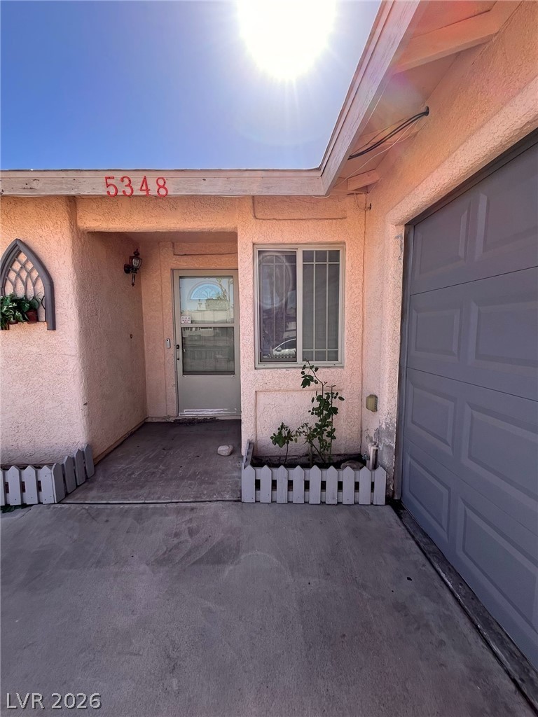 5348 Ravendale Circle Las Vegas, NV 89120 - Photo 2 of 2 A welcoming entry, with a sturdy garage door, creates inviting curb appeal.