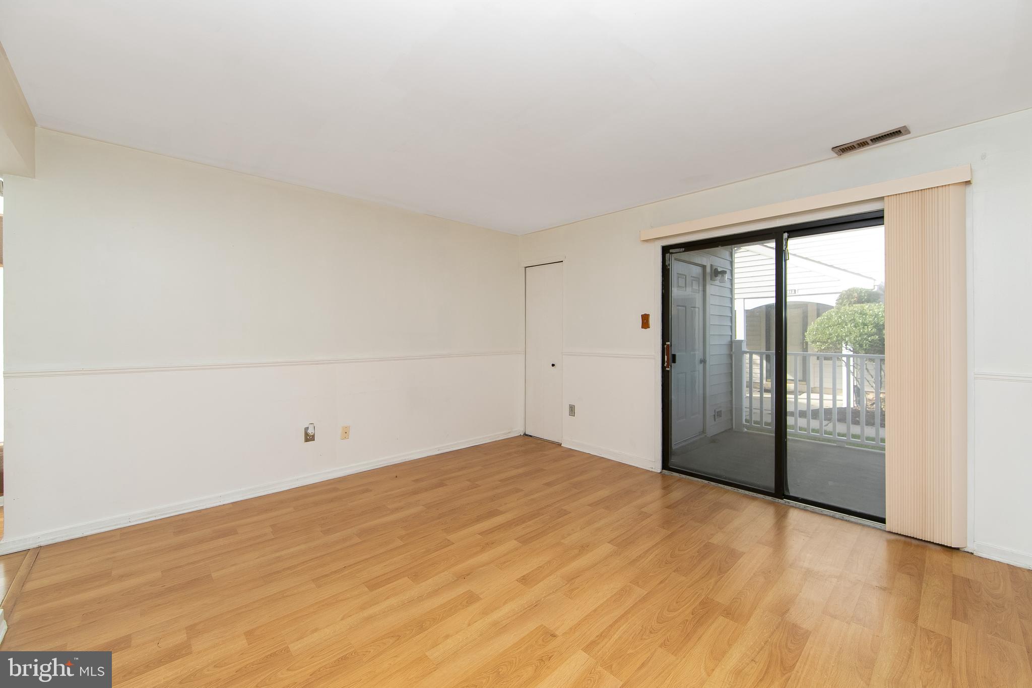 2207 Sandra Road Voorhees, NJ 08043 - Photo 12 of 24 wooden floor in an empty room with a window
