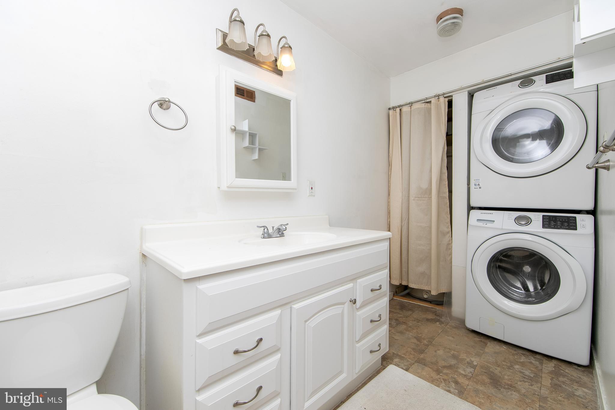 2207 Sandra Road Voorhees, NJ 08043 - Photo 15 of 24 a utility room with sink dryer and washer