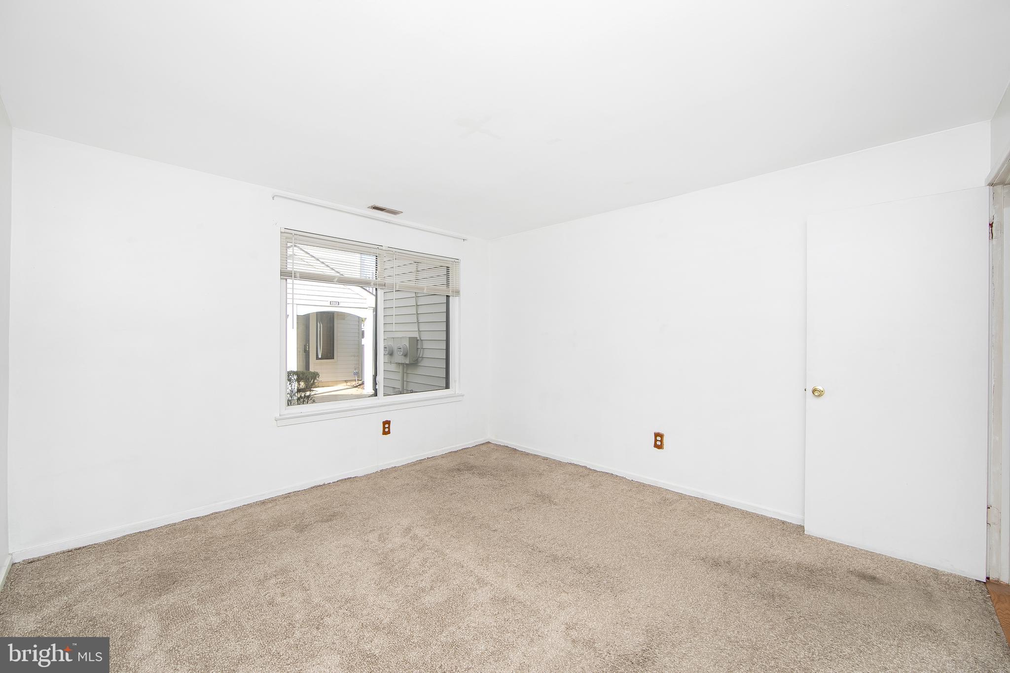 2207 Sandra Road Voorhees, NJ 08043 - Photo 20 of 24 a view of an empty room with a window