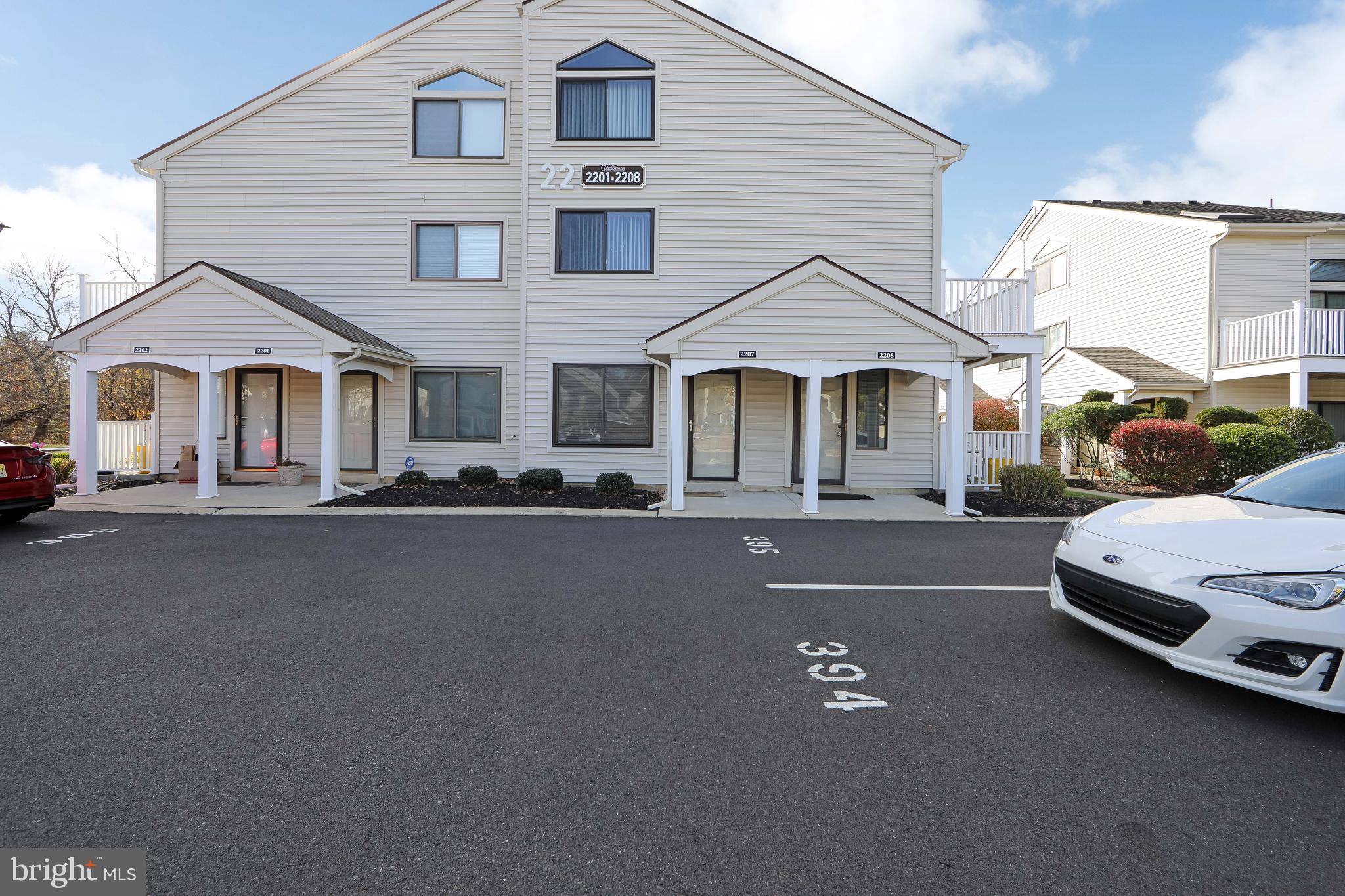 2207 Sandra Road Voorhees, NJ 08043 - Photo 2 of 24 a front view of a house with a garden