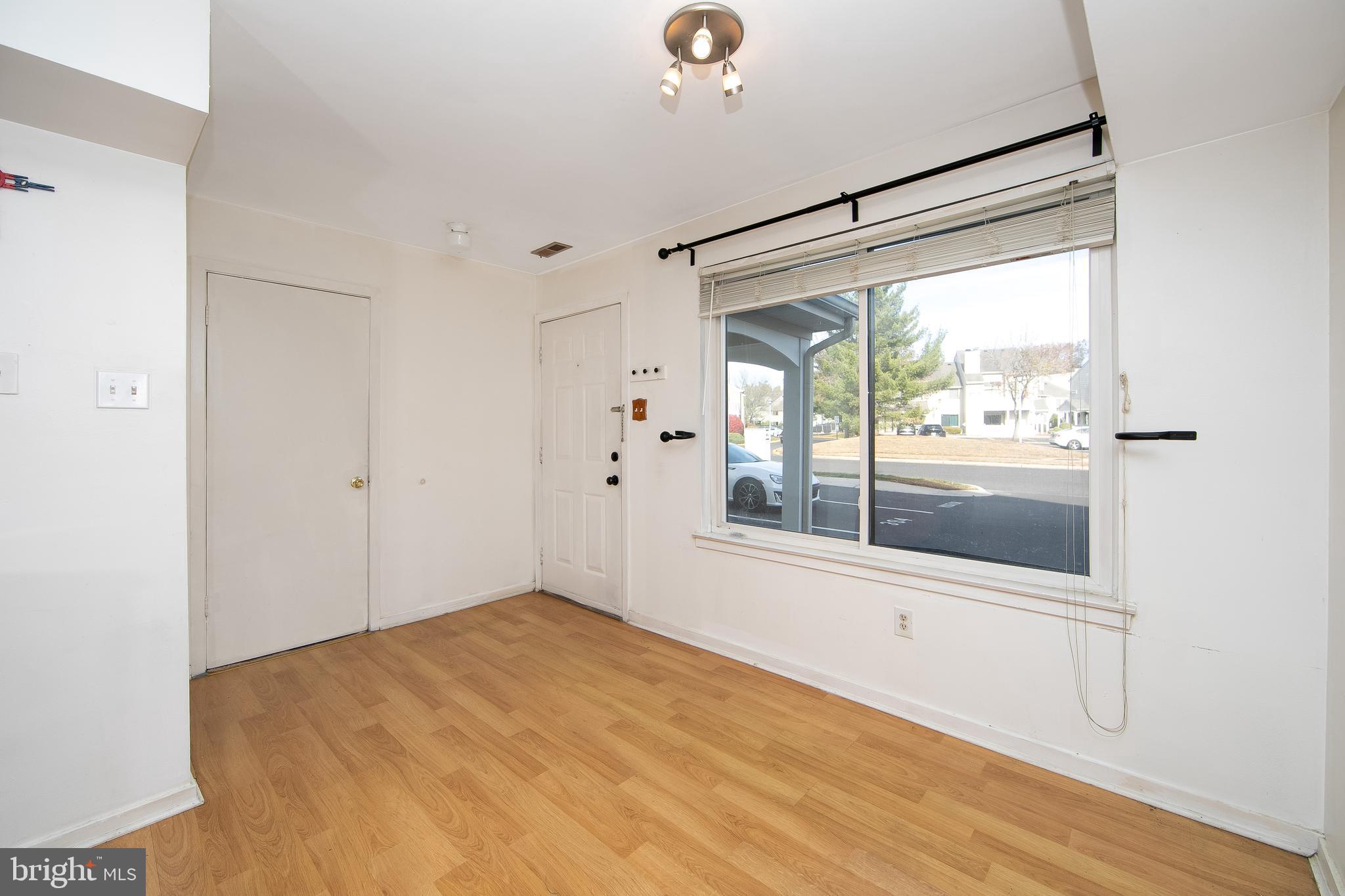 2207 Sandra Road Voorhees, NJ 08043 - Photo 8 of 24 a big room with wooden floor and windows