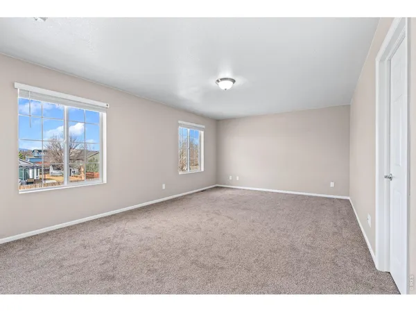 a bathroom with a sink mirror and a shower