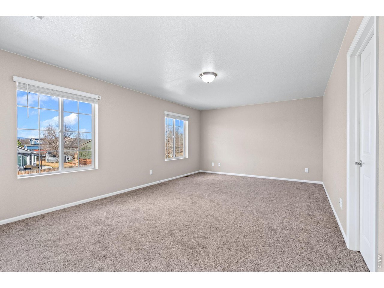 415 3rd Street Severance, CO 80550 - Photo 15 of 21 a view of an empty room with a window