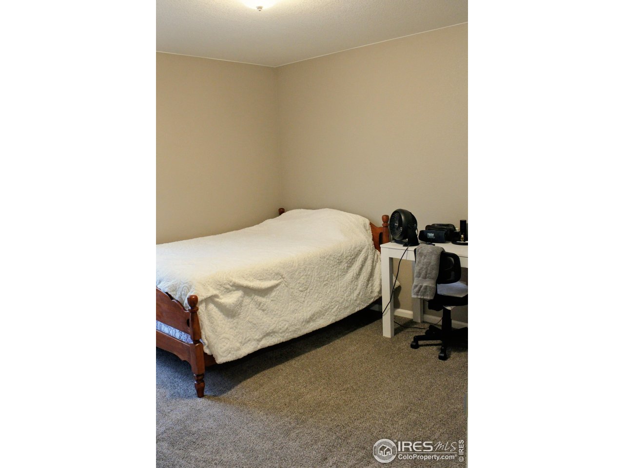 415 3rd Street Severance, CO 80550 - Photo 17 of 25 a bedroom with a bed and a cabinets