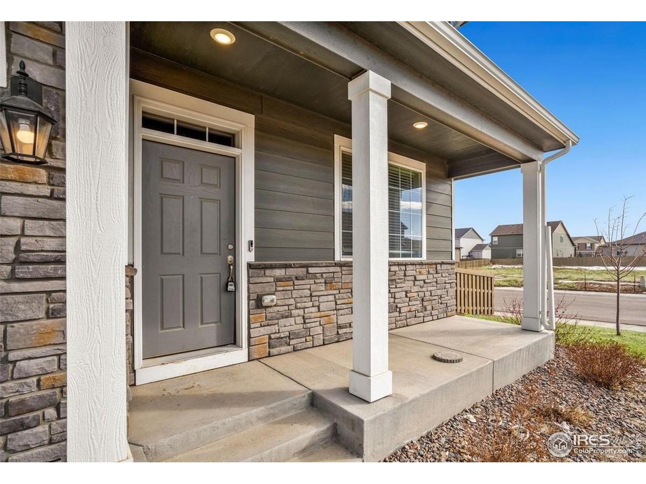 415 3rd Street Severance, CO 80550 - Photo 4 of 25 a view of a porch with a floor to ceiling window