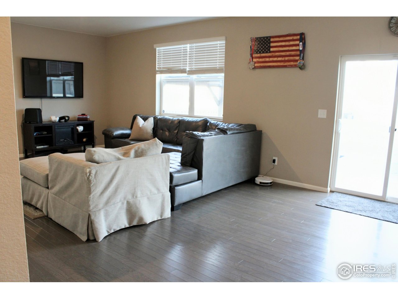 415 3rd Street Severance, CO 80550 - Photo 8 of 25 a living room with furniture and a window