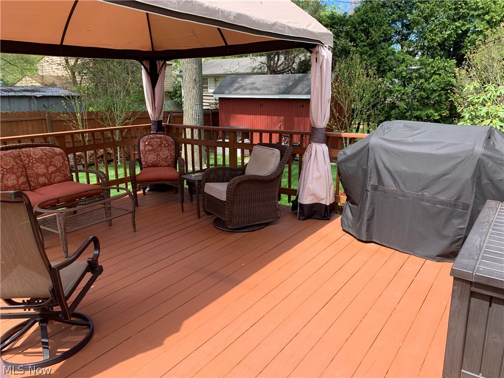 1842 Falkirk Road Madison, OH 44057 - Photo 22 of 25 Canopy on large wood deck remains with the home.