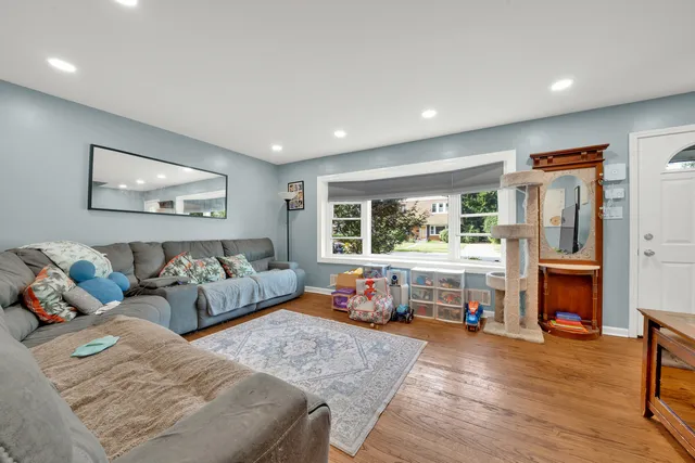 a bedroom with furniture and a fireplace