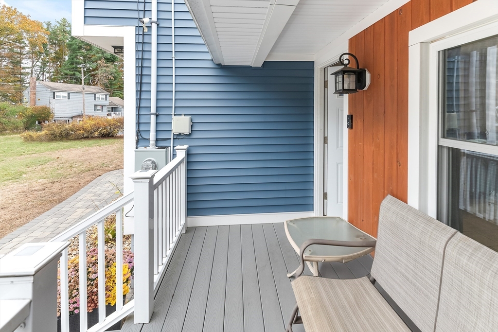 3 Garrison Road Salem, NH 03079 - Photo 10 of 40 a view of a balcony with chair and wooden floor